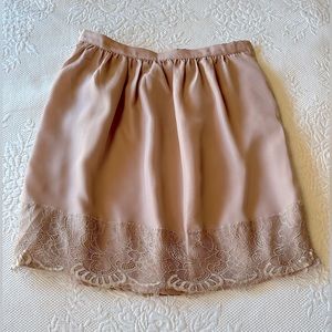 Forever 21 delicate lined- lace mini skirt. Tan color, silky texture, XS size